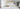 straight on photos of bed made up with Damask Bed linens. 4 regular pillows and 5 Boudoir cushions. Gold servering tray sitting on the foot of the bed with white and gold porcelain tea set
