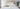 straight on photos of bed made up with Damask Bed linens. 4 regular pillows and 5 Boudoir cushions. Gold servering tray sitting on the foot of the bed with white and gold porcelain tea set